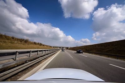 Road against cloudy sky