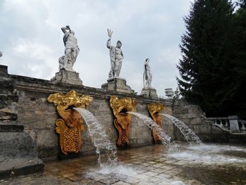 Statue of fountain against sky