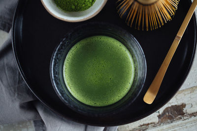 High angle view of matcha tea on table