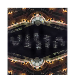 Digital composite image of illuminated buildings in city