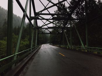 View of bridge over road in forest