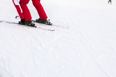 Low section of person skiing in snow