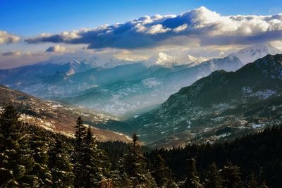 Scenic view of mountains against sky during winter