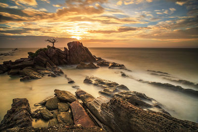 Scenic view of sea against sky during sunset