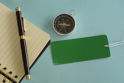 High angle view of clock on table