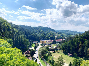 High angle view of trees and buildings against sky