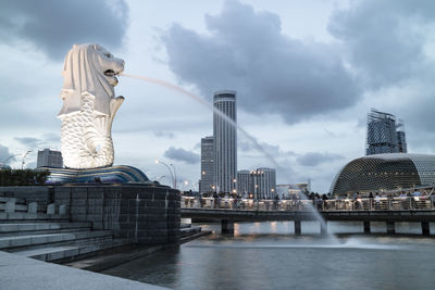 Merlion at marina bay with cloudy sky