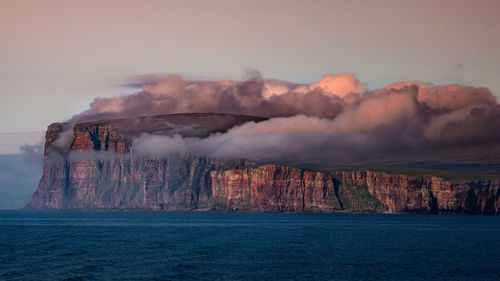 Man against sky at sunset