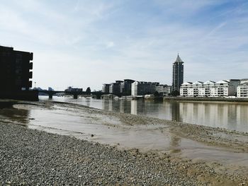 View of beach with city in background