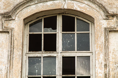 Low angle view of window of old building