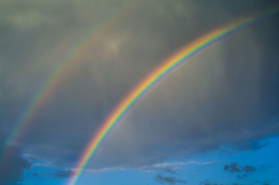 Low angle view of rainbow against sky