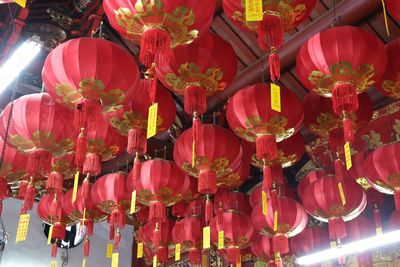 Low angle view of chinese lanterns hanging on roof