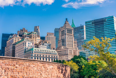 Buildings in city against sky