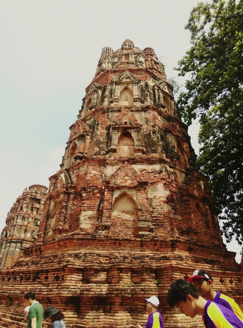 religion, place of worship, architecture, spirituality, built structure, building exterior, famous place, church, low angle view, tourism, travel destinations, history, travel, lifestyles, leisure activity, men, arch