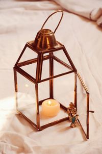 High angle view of illuminated lantern on table