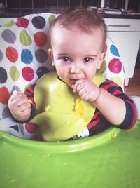Close-up portrait of boy eating food