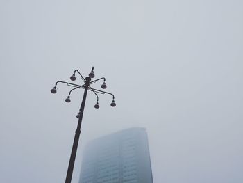 Low angle view of street light against clear sky