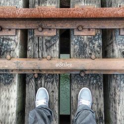 Low section of person standing on tiled floor