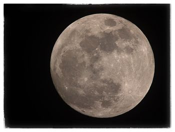 Low angle view of moon against clear sky at night