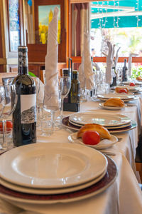 Glass of bottles on table in restaurant