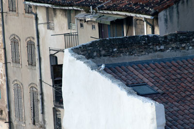 Houses by buildings in town