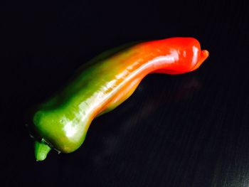 Close-up of red bell pepper against black background