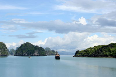 Ferry boat sailing in sea against sky