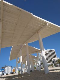 Low angle view of bridge against clear blue sky