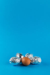 High angle view of eggs against blue background