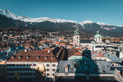 Aerial view of townscape against sky during winter