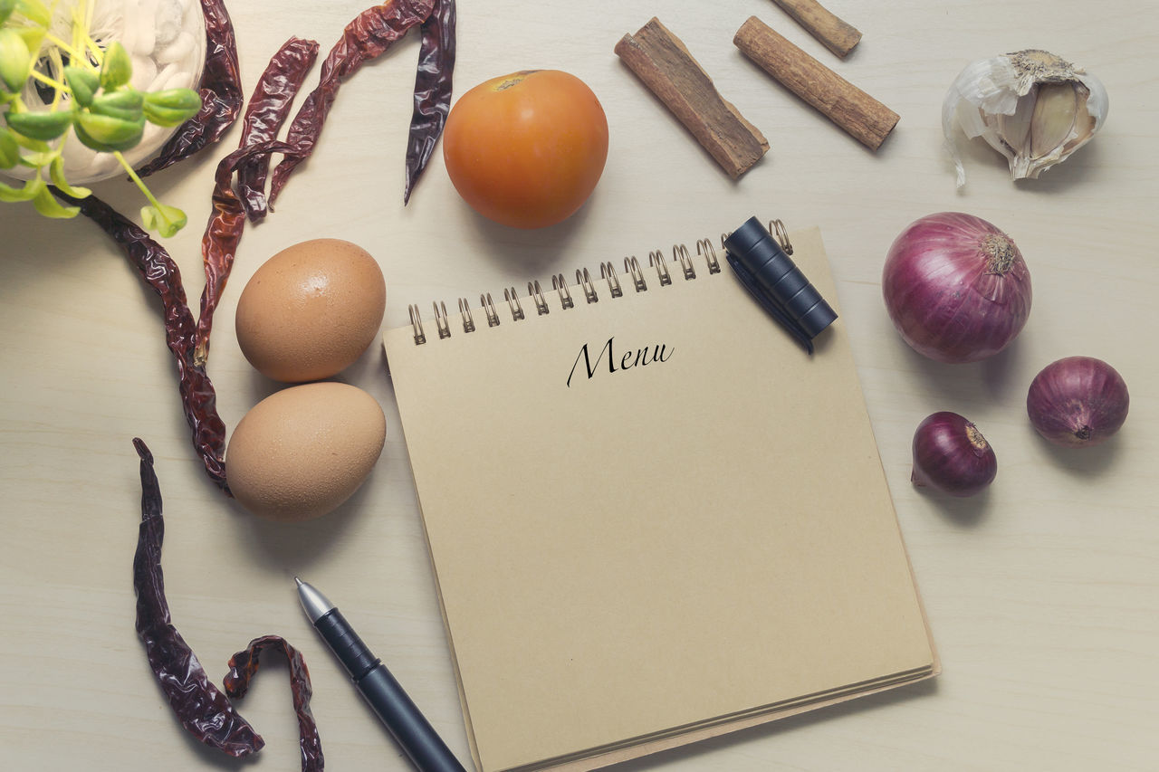 CLOSE-UP OF EGGS ON CUTTING BOARD IN KITCHEN