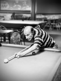 High angle view of man playing billiard