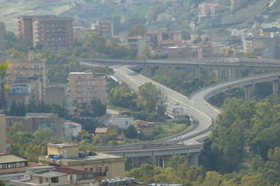 High angle view of road amidst buildings in city