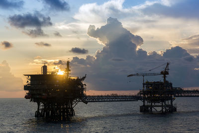 Silhouette of an oi production platform during sunset at offshore terengganu oil field