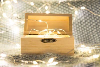 Close-up of illuminated lights on table