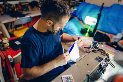 Man working on sewing machine