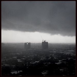 Cityscape against cloudy sky