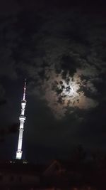 Low angle view of tower against cloudy sky