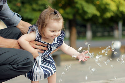 Mother and daughter in water