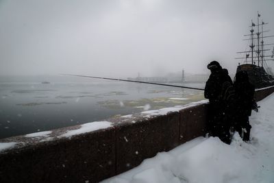 Scenic view of frozen sea against sky during winter