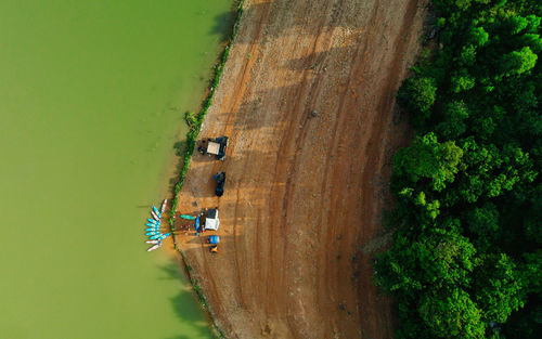 High angle view of people on land against trees