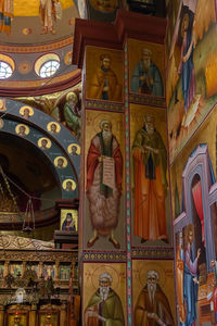 Low angle view of sculptures on ceiling of building