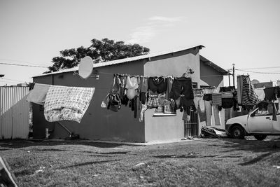 Clothes drying on clothesline against building