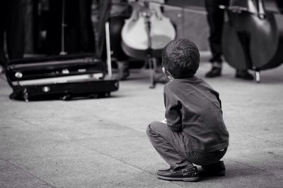 Full length of boy with arms raised