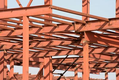 Low angle view of steel structure against sky, steel beams