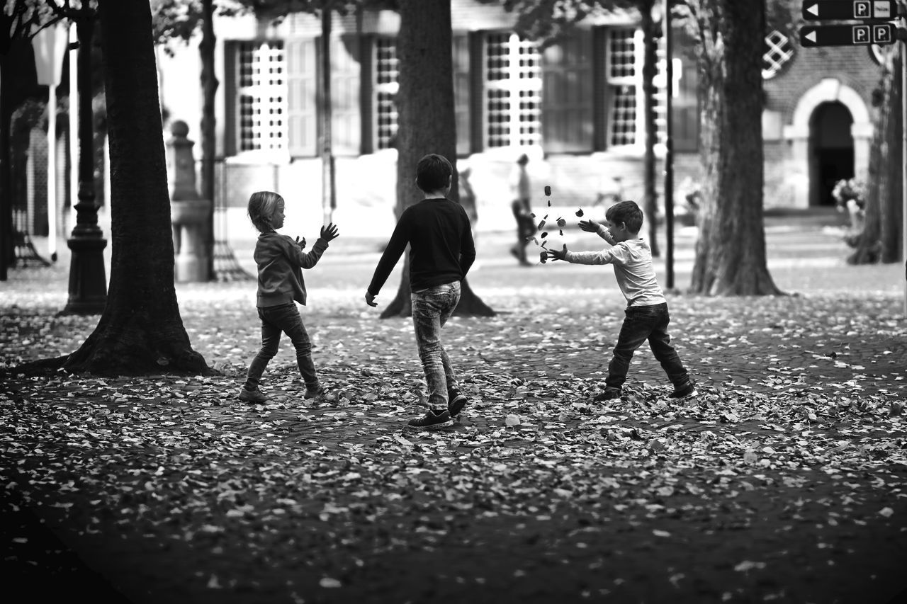 full length, childhood, street, real people, girls, walking, building exterior, outdoors, architecture, boys, day, child, people, adult
