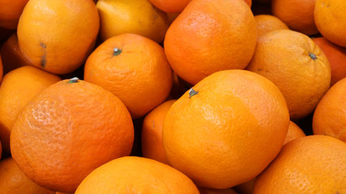 Full frame shot of oranges at market stall