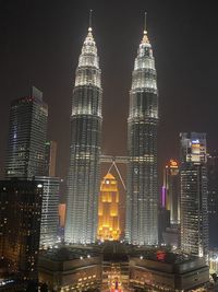 Illuminated buildings in city at night