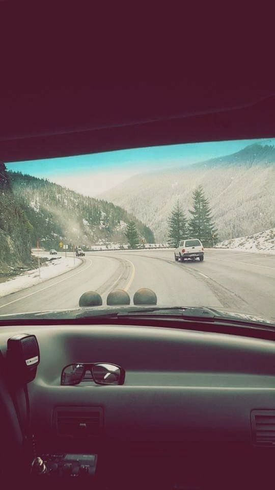 VEHICLES ON ROAD SEEN THROUGH CAR