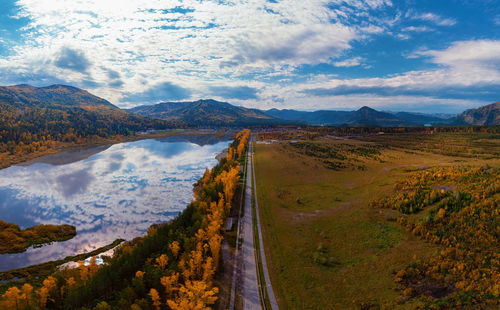 Panoramic view of road amidst mountains against sky